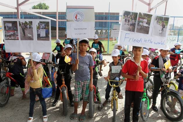 August 7, 2016 - Rafah, Gaza Strip, Palestinian Territory - Palestinian children take part in the bicycles marathon to demand their right to play and break the siege on Gaza strip, in Rafah in the southern Gaza Strip. on August 7, 2016 Rafah Palestinian Territory - ZUMAap3_