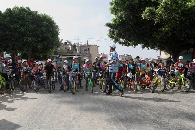 August 7, 2016 - Rafah, Gaza Strip, Palestinian Territory - Palestinian children take part in the bicycles marathon to demand their right to play and break the siege on Gaza strip, in Rafah in the southern Gaza Strip. on August 7, 2016 Rafah Palestinian Territory - ZUMAap3_