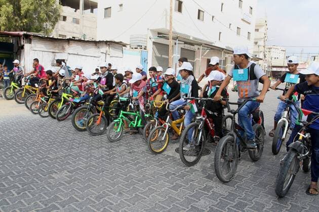 August 7, 2016 - Rafah, Gaza Strip, Palestinian Territory - Palestinian children take part in the bicycles marathon to demand their right to play and break the siege on Gaza strip, in Rafah in the southern Gaza Strip. on August 7, 2016 Rafah Palestinian Territory - ZUMAap3_