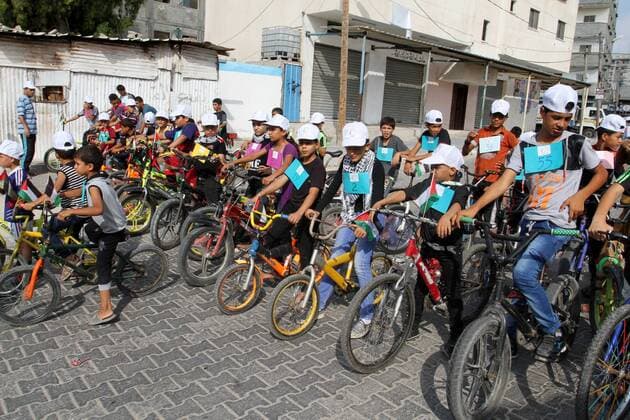 August 7, 2016 - Rafah, Gaza Strip, Palestinian Territory - Palestinian children take part in the bicycles marathon to demand their right to play and break the siege on Gaza strip, in Rafah in the southern Gaza Strip. on August 7, 2016 Rafah Palestinian Territory - ZUMAap3_