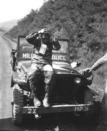 September 4, 1950 - North Korean prisoner of Marines who rolled enemy back in Naktong River fighting. He wears a Prisoner of War tag and was treated in accordance with United Nations rules of international warfare.  Copyright: StocktrekxImages stk106001m