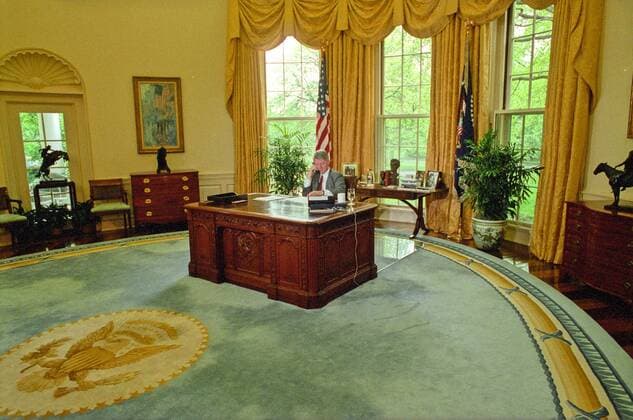 May 4, 1993 - Washington, District of Columbia, United States of America - United States President Bill Clinton participates in an Enterprise Zones phone call from the Oval Office of the White House in Washington, DC on Tuesday, May 4, 1993..The President s Enterprise Zones proposal is designed to attract investment capital into targeted urban areas and to streamline rules, regulations, and paperwork to reward incentive at the local level..Credit: Pool via CNP Washington United States of America - ZUMAs152
