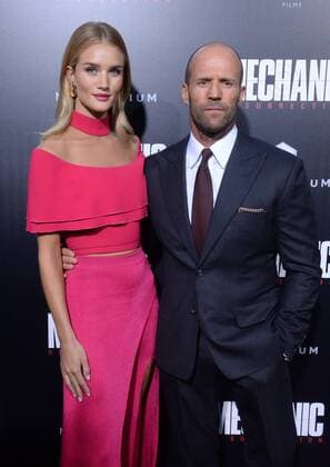 Cast member Jason Statham and his wife, English model Rosie Alice Huntington-Whiteley attend the premiere of the motion picture crime thriller Mechanic: Resurrection at the ArcLight Cinerama Dome in the Hollywood section of Los Angeles on August 22, 2016. Storyline: Arthur Bishop thought he had put his murderous past behind him when his most formidable foe kidnaps the love of his life. Now he is forced to travel the globe to complete three impossible assassinations, and do what he does best, make them look like accidents.  LAP2016082220 JIMxRUYMEN