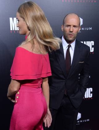 Cast member Jason Statham and his wife, English model Rosie Alice Huntington-Whiteley attend the premiere of the motion picture crime thriller Mechanic: Resurrection at the ArcLight Cinerama Dome in the Hollywood section of Los Angeles on August 22, 2016. Storyline: Arthur Bishop thought he had put his murderous past behind him when his most formidable foe kidnaps the love of his life. Now he is forced to travel the globe to complete three impossible assassinations, and do what he does best, make them look like accidents.  LAP2016082221 JIMxRUYMEN