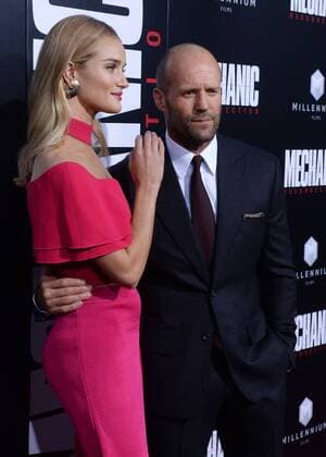 Cast member Jason Statham and his wife, English model Rosie Alice Huntington-Whiteley attend the premiere of the motion picture crime thriller Mechanic: Resurrection at the ArcLight Cinerama Dome in the Hollywood section of Los Angeles on August 22, 2016. Storyline: Arthur Bishop thought he had put his murderous past behind him when his most formidable foe kidnaps the love of his life. Now he is forced to travel the globe to complete three impossible assassinations, and do what he does best, make them look like accidents.  LAP2016082241 JIMxRUYMEN