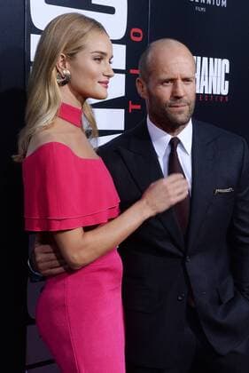 Cast member Jason Statham and his wife, English model Rosie Alice Huntington-Whiteley attend the premiere of the motion picture crime thriller Mechanic: Resurrection at the ArcLight Cinerama Dome in the Hollywood section of Los Angeles on August 22, 2016. Storyline: Arthur Bishop thought he had put his murderous past behind him when his most formidable foe kidnaps the love of his life. Now he is forced to travel the globe to complete three impossible assassinations, and do what he does best, make them look like accidents.  LAP2016082242 JIMxRUYMEN