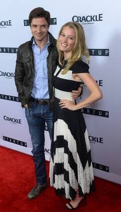 Cast member Ashley Hinshaw (R) and actor Topher Grace attend the premiere of Crackle s TV series crime drama Startup at the London Hotel in West Hollywood, California on August 23, 2016. Storyline: A desperate banker needs to conceal stolen money. A Haitian-American gang lord wants to go legit. A Cuban-American hacker has an idea that will revolutionize the very future of money itself. Forced to work together, they unwittingly create their version of the American dream - organized crime 2.0.  LAP2016082318 JIMxRUYMEN