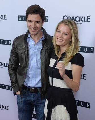 Cast member Ashley Hinshaw (R) and actor Topher Grace attend the premiere of Crackle s TV series crime drama Startup at the London Hotel in West Hollywood, California on August 23, 2016. Storyline: A desperate banker needs to conceal stolen money. A Haitian-American gang lord wants to go legit. A Cuban-American hacker has an idea that will revolutionize the very future of money itself. Forced to work together, they unwittingly create their version of the American dream - organized crime 2.0.  LAP2016082320 JIMxRUYMEN