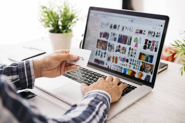 Man with laptop and credit card shopping online, partial view model released Symbolfoto property released  JRFF000784