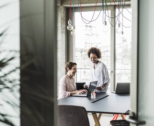 Two women working together in office model released Symbolfoto property released  UUF008211