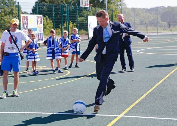 Kaliningrad: Alexei Miller weiht FuÃŸballplatz ein KALININGRAD REGION, RUSSIA - AUGUST 26, 2016: Chairman of the board at Gazprom Alexei Miller (front) kicks the ball during a ceremony at a new sportsground built by Gazprom for a local school in the town of Chernyakhovsk. Vitaly Nevar TASS  TS02ECB8