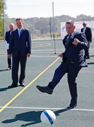 Kaliningrad: Alexei Miller weiht FuÃŸballplatz ein KALININGRAD REGION, RUSSIA - AUGUST 26, 2016: Acting governor of Kaliningrad Region Yevgeny Zinichev (front) kicks the ball as chairman of the board at Gazprom Alexei Miller (L) looks on during a ceremony at a new sportsground built by Gazprom for a local school in the town of Chernyakhovsk. Vitaly Nevar TASS  TS02ECB7