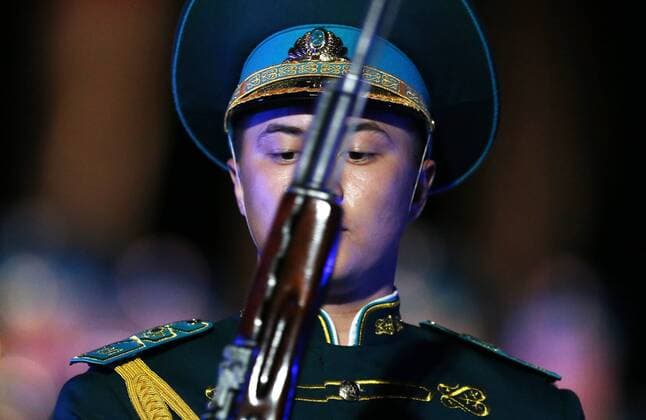 MOSCOW, RUSSIA - AUGUST 27, 2016: A member of the Honor Guard and the Band of the Presidential Regiment Aibyn of Kazakhstan performs at the opening of the 9th Spasskaya Tower international military music festival in Moscow s Red Square. Artyom Geodakyan TASS  TS02EF5E