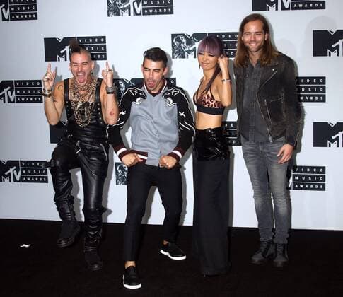 August 28, 2016 - New York, New York, U.S. - Members of DNCE, COLE WHITTLE, JOE JONAS, JINJOO LEE and JACK LAWLESS pose for photos in the press room at the 2016 MTV Video Music Awards held at Madison Square Garden. New York U.S. - ZUMAk03_