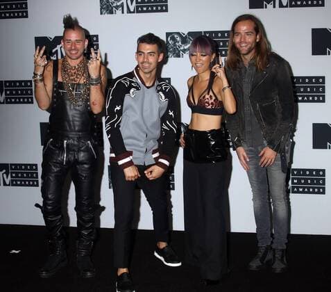 August 28, 2016 - New York, New York, U.S. - Members of DNCE, COLE WHITTLE, JOE JONAS, JINJOO LEE and JACK LAWLESS pose for photos in the press room at the 2016 MTV Video Music Awards held at Madison Square Garden. New York U.S. - ZUMAk03_