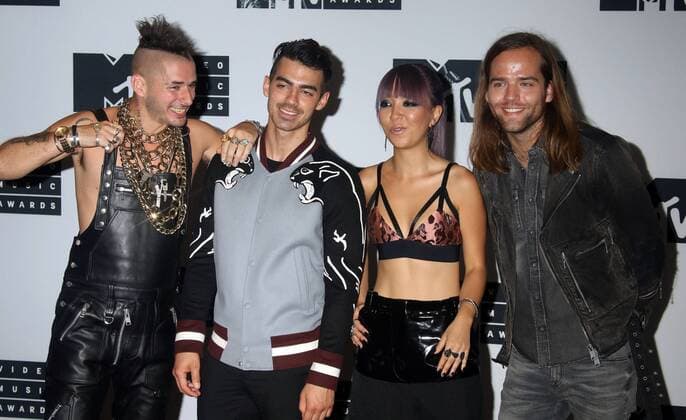 August 28, 2016 - New York, New York, U.S. - Members of DNCE, COLE WHITTLE, JOE JONAS, JINJOO LEE and JACK LAWLESS pose for photos in the press room at the 2016 MTV Video Music Awards held at Madison Square Garden. New York U.S. - ZUMAk03_