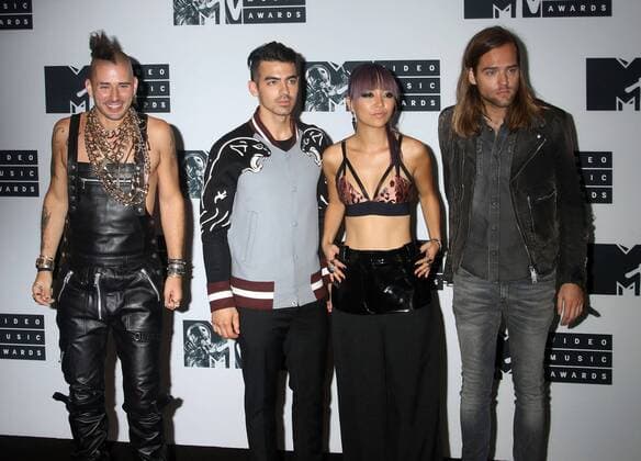 August 28, 2016 - New York, New York, U.S. - Members of DNCE, COLE WHITTLE, JOE JONAS, JINJOO LEE and JACK LAWLESS pose for photos in the press room at the 2016 MTV Video Music Awards held at Madison Square Garden. New York U.S. - ZUMAk03_