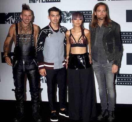 August 28, 2016 - New York, New York, U.S. - Members of DNCE, COLE WHITTLE, JOE JONAS, JINJOO LEE and JACK LAWLESS pose for photos in the press room at the 2016 MTV Video Music Awards held at Madison Square Garden. New York U.S. - ZUMAk03_