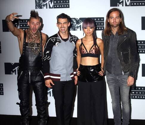August 28, 2016 - New York, New York, U.S. - Members of DNCE, COLE WHITTLE, JOE JONAS, JINJOO LEE and JACK LAWLESS pose for photos in the press room at the 2016 MTV Video Music Awards held at Madison Square Garden. New York U.S. - ZUMAk03_