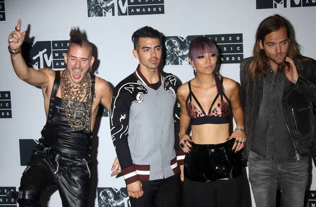 August 28, 2016 - New York, New York, U.S. - Members of DNCE, COLE WHITTLE, JOE JONAS, JINJOO LEE and JACK LAWLESS pose for photos in the press room at the 2016 MTV Video Music Awards held at Madison Square Garden. New York U.S. - ZUMAk03_