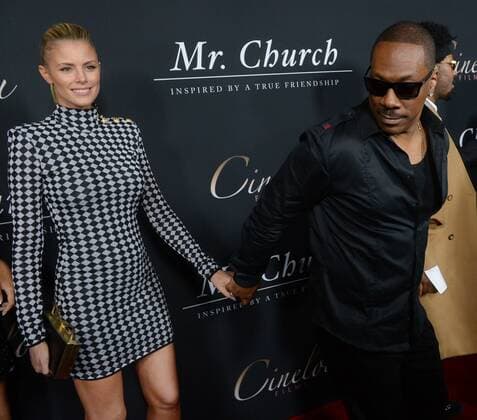 Cast member Eddie Murphy and his girlfriend, Australian actress Paige Butcher attend the premiere of the motion picture drama Mr. Church at the ArcLight Cinema Dome in the Hollywood section of Los Angeles on September 6, 2016. Storyline: Mr. Church tells the story of a unique friendship that develops when a little girl and her dying mother retain the services of a talented cook - Henry Joseph Church. What begins as a six month arrangement instead spans fifteen years, and creates a family bond that lasts forever.  LAP2016090611 JIMxRUYMEN