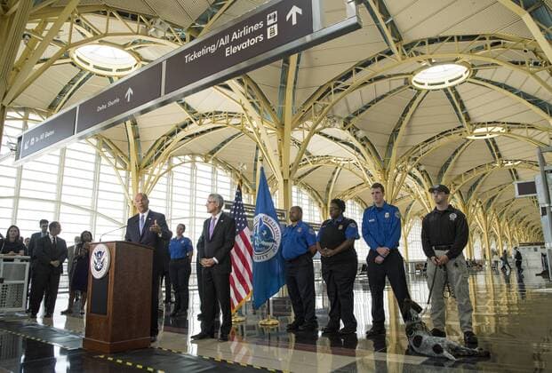 Homeland Security Jeh Johnson, joined by members of the Transportation Security Administration (TSA) speaks about the success of the TSA s recent measures to to reduce wait times for security screenings while maintaining safety during a press conference at Ronald Reagan Washington National Airport in Arlington, Virginia on September 7, 2016.  WAP20160907310 KEVINxDIETSCH