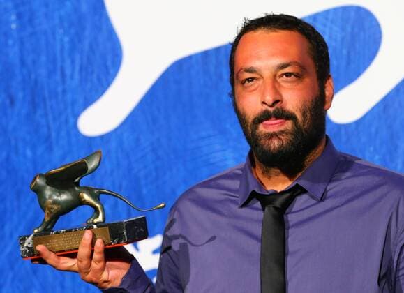 VENICE, Sept. 10, 2016 -- Director Ala Eddine Slim poses with the Lion of the Future Luigi de Laurentiis Venice award for the movie The Last of Us during the award winners photocall of the 73rd Venice Film Festival in Venice, Italy, on Sept. 10, 2016. )(axy) ITALY-VENICE-73RD FILM FESTIVAL-AWARD GongxBing 