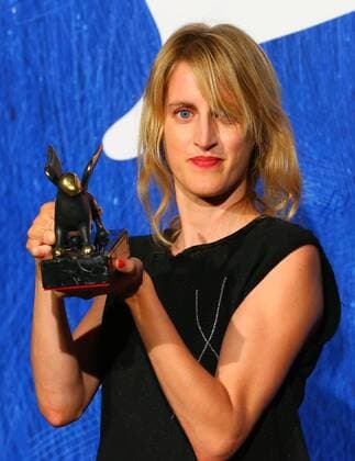 VENICE, Sept. 10, 2016 -- Director Fien Troch poses with the Orizzonti Award for Best Director for Home during the award winners photocall of the 73rd Venice Film Festival in Venice, Italy, on Sept. 10, 2016. )(axy) ITALY-VENICE-73RD FILM FESTIVAL-AWARD GongxBing 