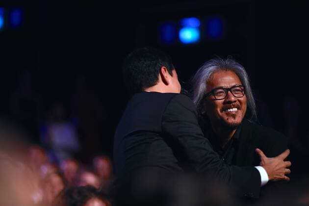 VENICE, Sept. 10, 2016 -- Director Lav Diaz (R) celebrates with one cast member after winning the Golden Lion prize for his movie The Woman Who Left during the award ceremony at the 73rd Venice Film Festival, at the Lido of Venice, Italy, Sept. 10, 2016. The Woman Who Left by Philippine director Lav Diaz won the Golden Lion, the highest prize presented at the 73rd Venice International Film Festival which concluded here on Saturday evening. )(axy) ITALY-VENICE-73RD FILM FESTIVAL-AWARD JinxYu 