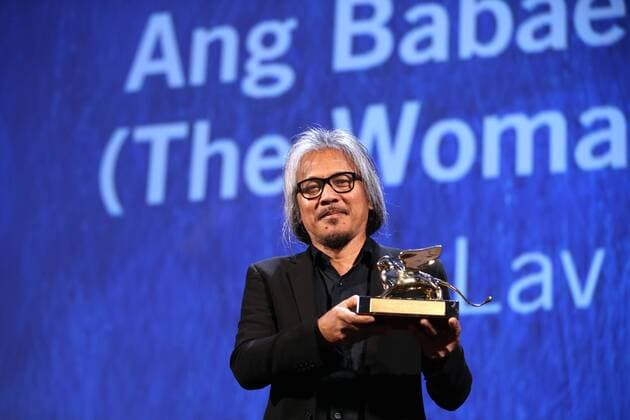 VENICE, Sept. 10, 2016 -- Director Lav Diaz holds the Golden Lion prize for his movie The Woman Who Left during the award ceremony at the 73rd Venice Film Festival, at the Lido of Venice, Italy, Sept. 10, 2016. The Woman Who Left by Philippine director Lav Diaz won the Golden Lion, the highest prize presented at the 73rd Venice International Film Festival which concluded here on Saturday evening. )(axy) ITALY-VENICE-73RD FILM FESTIVAL-AWARD JinxYu 