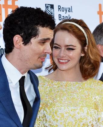 Emma Stone chats with director Damien Chazelle as they arrive at the Toronto International Film Festival premiere of La La Land at the Princess of Wales Theatre in Toronto, Canada on September 12, 2016.  TOR2016091229 CHRISTINExCHEW