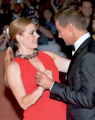 Amy Adams and Jeremy Renner do a little dance on the red carpet as they arrive at the Toronto International Film Festival premiere of Arrival at Roy Thomson Hall in Toronto, Canada on September 12, 2016.  TOR2016091235 CHRISTINExCHEW