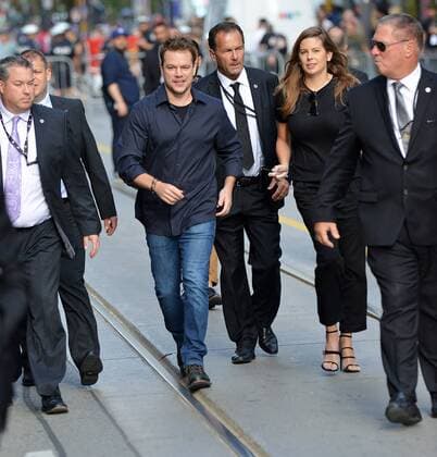 Surrounded by a security team, Matt Damon (in blue jeans) arrives at the Toronto International Film Festival premiere of Manchester By The Sea at the Princess of Wales Theatre in Toronto, Canada on September 13, 2016.  TOR2016091313 CHRISTINExCHEW