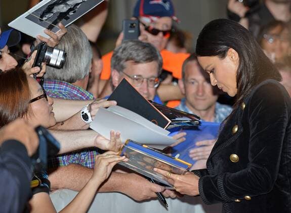 Michelle Rodriguez signs autographs for fans as she arrives at the Toronto International Film Festival premiere of (re)Assignment at Ryerson Theatre in Toronto, Canada on September 14, 2016.  TOR2016091424 CHRISTINExCHEW