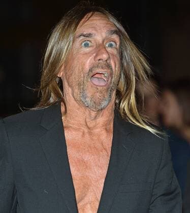 Singer Iggy Pop greets the photo pit with high energy as he arrives at the Toronto International Film Festival premiere of Gimme Danger at Ryerson Theatre in Toronto, Canada on September 14, 2016.  TOR2016091421 CHRISTINExCHEW