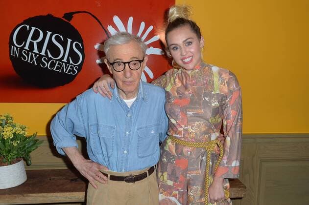 Woody Allen and Miley Cyrus pose together at The Crisis in Six Scenes premiere at The Crosby Street Hotel in New York City on September 15, 2016.  NYP201609150701A ANDREAxHANKS