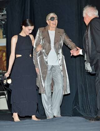 Rooney Mara (L) and Vanessa Redgrave walk out barefoot onto the stage with an assist from director Jim Sheridan (R) for the cast introductions at the Toronto International Film Festival premiere of The Secret Scripture at Roy Thomson Hall in Toronto, Canada on September 15, 2016.  TOR2016091521 CHRISTINExCHEW