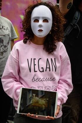 UK: LFW targeted by Animal Cruelty Protestors Animal cruelty protester holds a video showing cruelty as they target London Fashion Week s runway show audiences causing the Metropolitan Police Service to close roads surrounding the event in London FOR EDITORIAL USE ONLY.Pacific Press Agency  HughxPeterswald