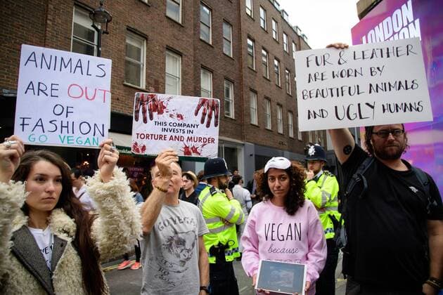 UK: LFW targeted by Animal Cruelty Protestors Metropolitan Police Service officers stand by as animal rights protesters target audiences exiting a London Fashion Week s runway show. FOR EDITORIAL USE ONLY.Pacific Press Agency  HughxPeterswald