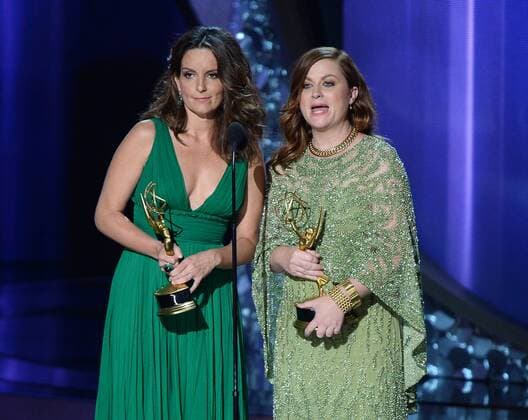 Actresses Tina Fey (L) and Amy Poehler speak onstage during the 68th annual Primetime Emmy Awards at Microsoft Theater in Los Angeles on September 18, 2016.  LAP201609180208 JIMxRUYMEN