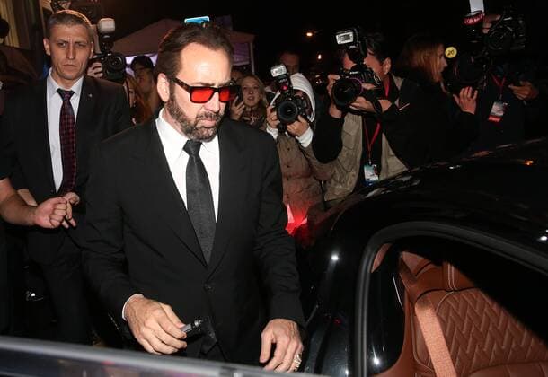 MOSCOW, RUSSIA - SEPTEMBER 20, 2016: American actor Nicolas Cage (front) after the Russian premiere of a new action film, USS Indianapolis: Men of Courage, directed by Mario Van Peebles, at the 5 Zvyozd Na Paveletskoi Cinema Hall. Vyacheslav Prokofyev TASS  TS031D07