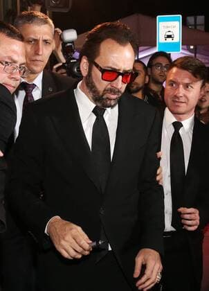 MOSCOW, RUSSIA - SEPTEMBER 20, 2016: American actor Nicolas Cage (C) after the Russian premiere of a new action film, USS Indianapolis: Men of Courage, directed by Mario Van Peebles, at the 5 Zvyozd Na Paveletskoi Cinema Hall. Vyacheslav Prokofyev TASS  TS031D08