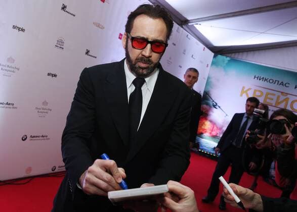 MOSCOW, RUSSIA - SEPTEMBER 20, 2016: American actor Nicolas Cage signs autographs at the Russian premiere of a new action film, USS Indianapolis: Men of Courage, directed by Mario Van Peebles, at the 5 Zvyozd Na Paveletskoi Cinema Hall. Vyacheslav Prokofyev TASS  TS031CF9