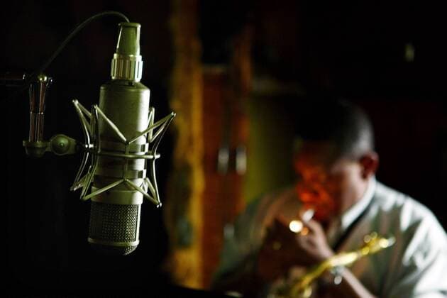 May 26, 2009 - Memphis, TN, U.S. - Tues 26 May 09 (mbmusic07) Photo by Mike Brown..MEMPHIS MUSIC HEAR AND NOW: Passing the Torch - Saxophone player Lannie McMillan sparks up a cigarette during recording session at Royal Studios for local band Dearing and Down. The storied studio, started by famed producer Willie Mitchell, stays booked months in advance with Willie Mitchell s son Lawrence Boo Mitchell behind the board. It s not uncommon in Memphis that children of music legends from the past are carrying the torch into the future. - ZUMAc51_
