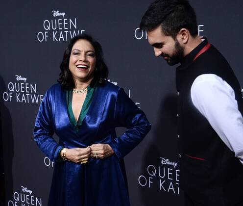 Director Mira Nair (L) attends the premiere of her new motion picture biographical sport drama Queen of Katwe with her son Zohran Mamdani, who curated the film s soundtrack, at the El Capitan Theatre in the Hollywood section of Los Angeles on September 20, 2016.  LAP2016092034 JIMxRUYMEN