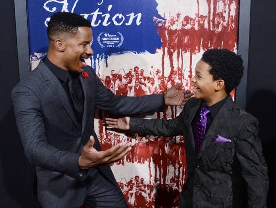 Writer director and cast member Nate Parker (L) and cast member Tony Espinosa attend the premiere of the motion picture drama The Birth of a Nation at the ArcLight Cinerrama Dome in the Hollywood section of Los Angeles on September 21, 2016. Storyline: Nat Turner, a literate slave and preacher in the antebellum South, orchestrates an uprising.  LAP2016092121 JIMxRUYMEN