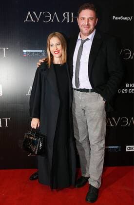 MOSCOW, RUSSIA - SEPTEMBER 21, 2016: Russian actor Maxim Vitorgan (R) and his wife, Russian TV presenter Ksenia Sobchak attend the Moscow premiere of Russian director Alexei Mizgirev s new film The Duelist at the Formula Kino na Kutuzovskom Cinema. Sergei Fadeichev TASS  TS031F4A