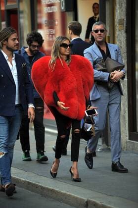 Milan, Fur heart-shaped E began the week of women s fashion, and in the center there s people wearing some curious heads and extravagant, albeit signed. In the photo a girl walks in via Montenapoleone wearing a fur coat in a heart shape, a Moschino s signature.  Copyright: xMimmoxCarrierox