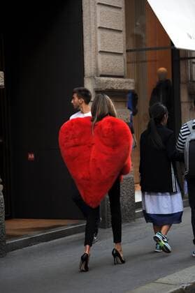 Milan, Fur heart-shaped E began the week of women s fashion, and in the center there s people wearing some curious heads and extravagant, albeit signed. In the photo a girl walks in via Montenapoleone wearing a fur coat in a heart shape, a Moschino s signature.  Copyright: xMimmoxCarrierox