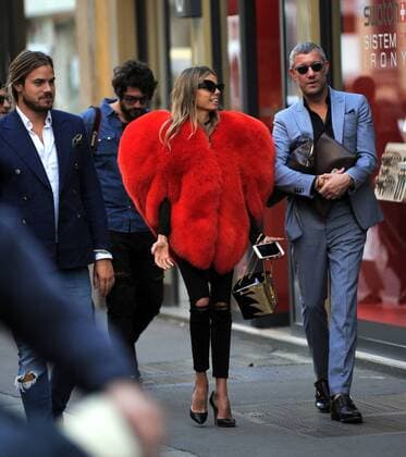 Milan, Fur heart-shaped E began the week of women s fashion, and in the center there s people wearing some curious heads and extravagant, albeit signed. In the photo a girl walks in via Montenapoleone wearing a fur coat in a heart shape, a Moschino s signature.  Copyright: xMimmoxCarrierox